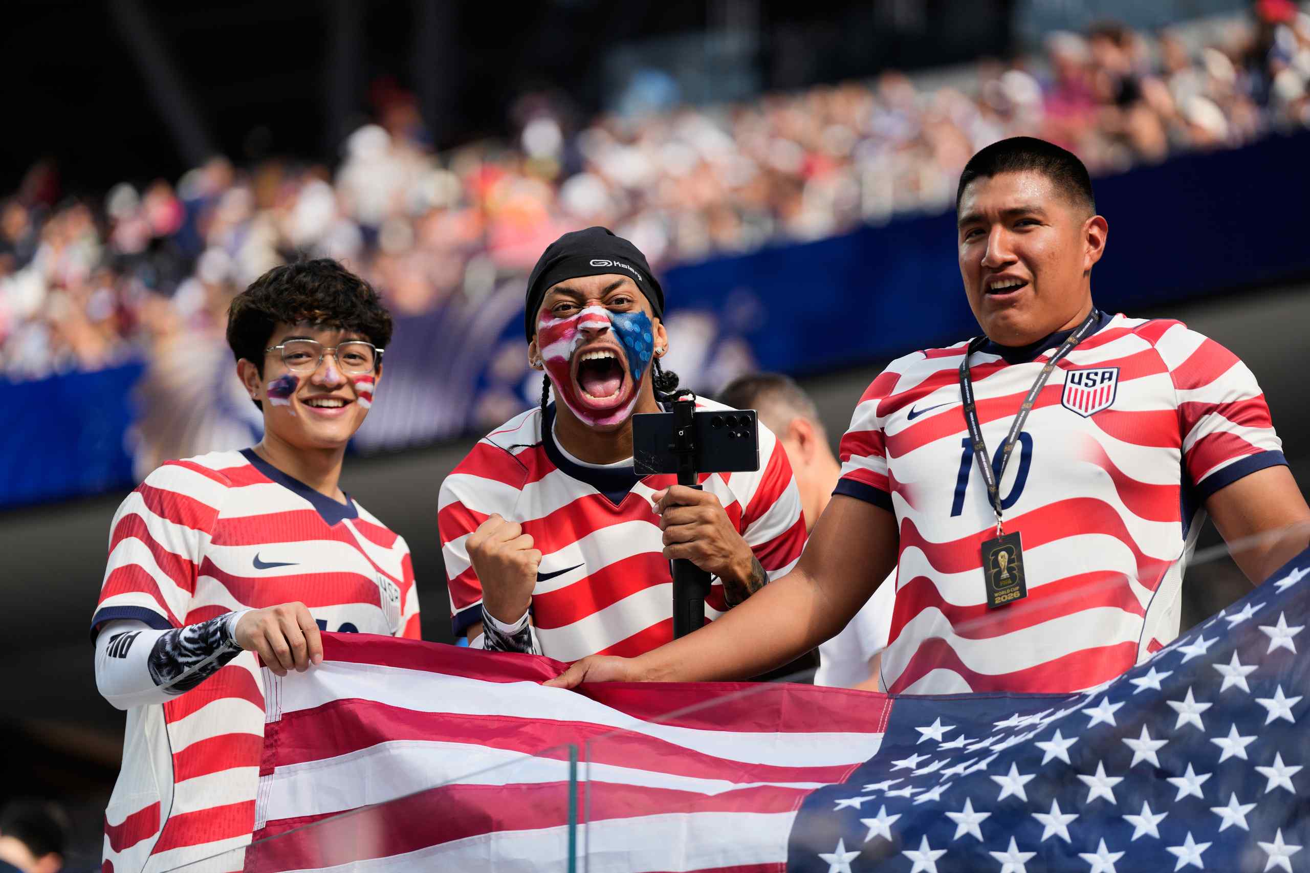 US soccer fans cheering their team on to victory in the first US game of the World Cup.